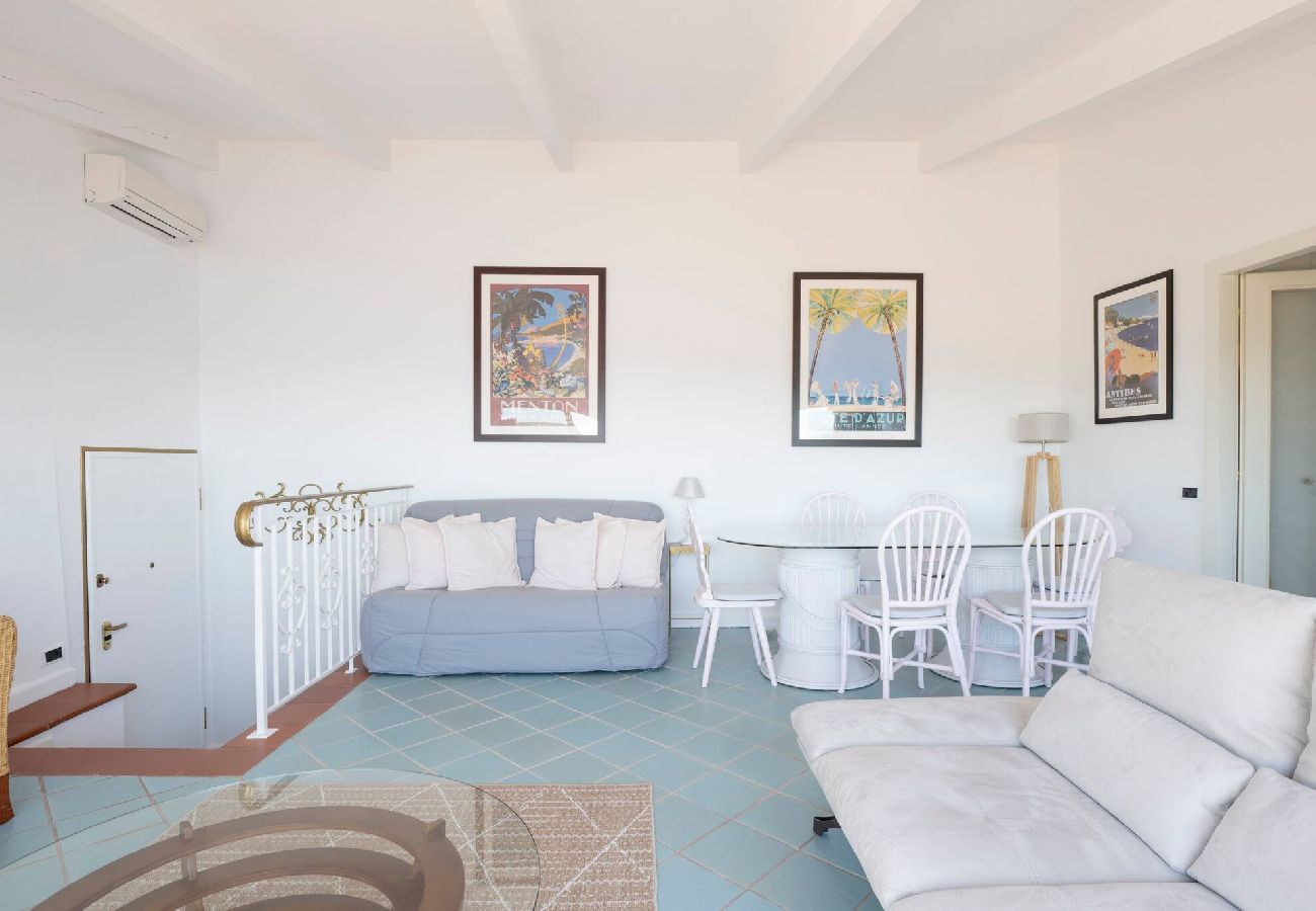 Living room with sofa bed and dining table