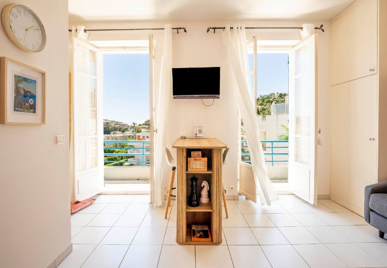  Living room with dining table and access to the terrace