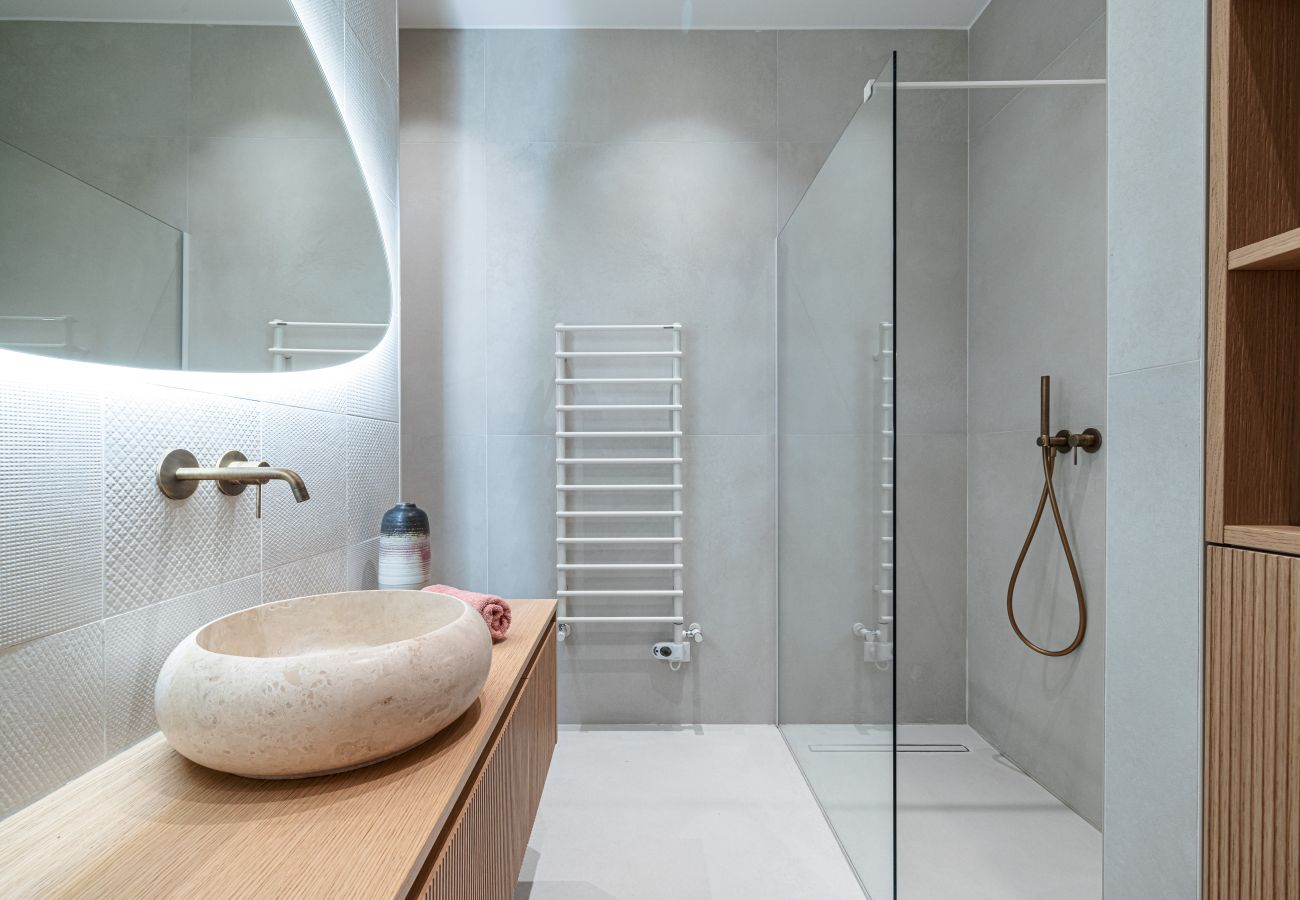 Bathroom with large shower and sink